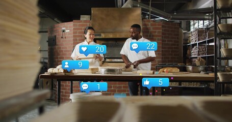 Shaping dough, two bakers in aprons handling loaves at bakery worktable with social media overlays