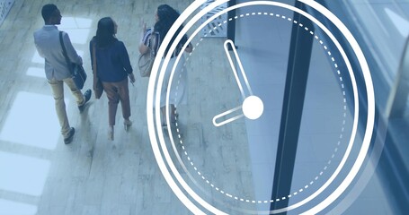 Three colleagues in blazers walking and talking in lobby, clock overlay, carrying bags, copy space