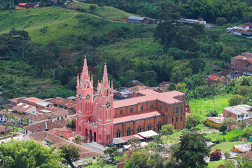 Beautiful Gothic-style church named Shrine of Saint Mother Laura. Its style is surprising: candy-pink walls in Jericó, antioquia, Colombia.