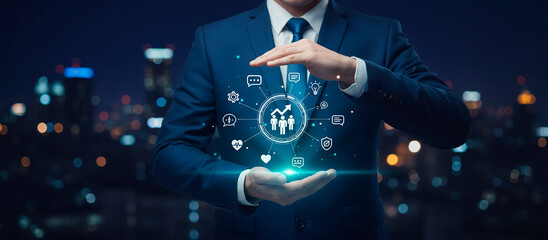 Business professional holding a glowing digital graphic in cupped hands. The graphic features interconnected icons representing growth, teamwork, innovation, communication, and strategic planning.