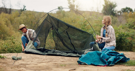 Tent, help and couple with nature, support and assistance with adventure, vacation and teamwork. Camping, man and woman with preparation, setting up and talking with recreation and holiday in Canada