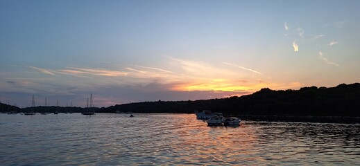 Naklejka premium Beautiful natural landscapes, crystal-clear turquoise water, dramatic rocky coastline, and breathtaking panoramic views. The Adriatic Sea shines under the summer sun, with charming coastal scenery.