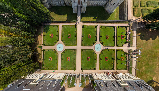 Aerial view of the meticulously manicured gardens with symmetrical lawns, fountains, and vibrant flowers, Chaumont-sur-Loire, Centre-Val de Loire, France.