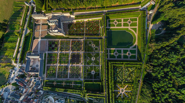 Aerial view of manicured gardens and historic architecture, a tapestry of green and stone blending seamlessly, Chaumont-sur-Loire, Centre-Val de Loire, France.