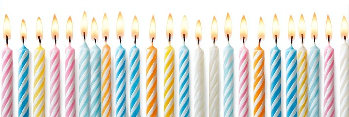 A high-resolution, panoramic studio photograph showcasing a symmetrical row of multiple brightly lit birthday candles against a clean, plain white background.