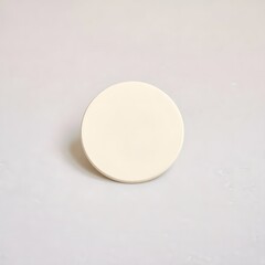 A white round object on a plain background
