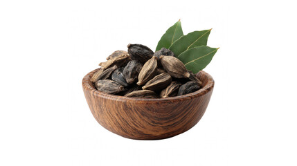 Rustic wooden bowl filled with dark black cardamom pods and vibrant green bay leaves