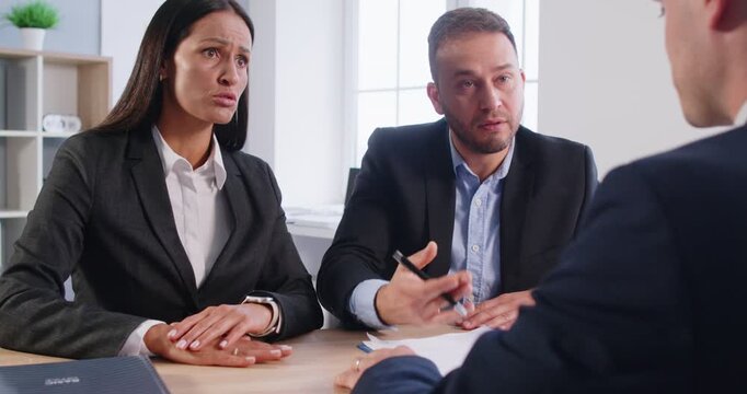 Aggressive client in the office engages in violence, threatening and attacking a financial consultant or real estate agent during a meeting. The atmosphere becomes hostile amid the client anger.