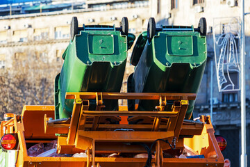 Wheelie bin garbage truck specialized refuse vehicle designed to mechanically lift empty and return plastic wheelie bins large wheeled rubbish containers