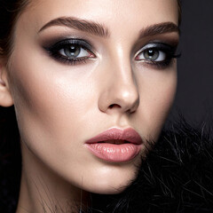 Close-up luxury beauty portrait of an elegant woman wearing a black fur coat. Perfect for fashion, cosmetics, glamour, skincare, luxury branding, and high-end advertising concepts.
