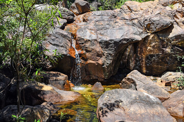 the amazing Boulder Creek Falls in Kakadu National Park, with natural swimming pool at the bottom, Northern Territory, Australia
