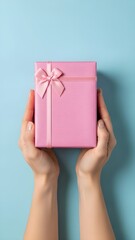 Valentine's day gift giving concept with pink wrapped present