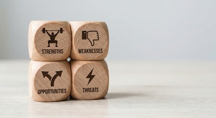 Four wooden blocks displaying SWOT analysis icons for strengths, weaknesses, opportunities
