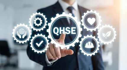 Professional Southeast Asian businessman in a suit pointing at a glowing digital QHSE gear icon representing Quality Health Safety and Environment management systems in a modern office.