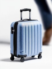 Light Blue Textured Carry On Suitcase With Silver Trim And Black Wheels Isolated On White