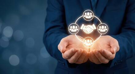 Businessman holding a glowing handshake icon, symbolizing business partnership and teamwork with a network of people.