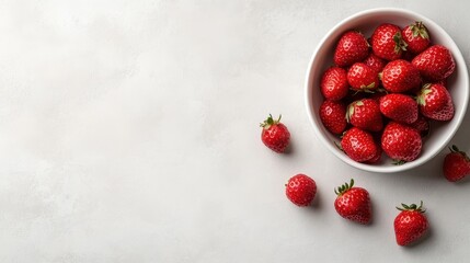 White Bowl Filled With Ripe Red Strawberries Sprinkled With Sugar Against A Textured White Background