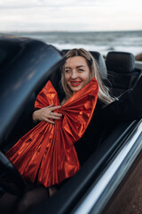 Happy Woman Receiving a Car as a Gift