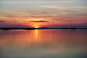 Obraz premium sunset over the river