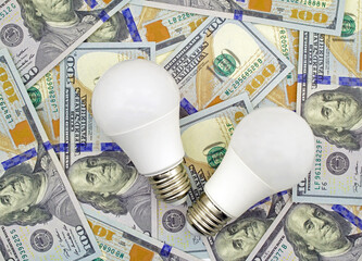 led light bulb on dollar banknotes background