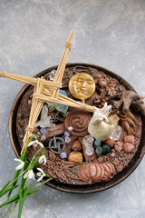 Wiccan altar for Imbolc sabbat. witchcraft, magic ritual. wheel of the year, straw Brigid's cross...