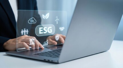 Hands typing on laptop with ESG interface, sustainable business strategy