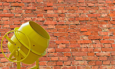 Concrete Mixer against the background of brick wall