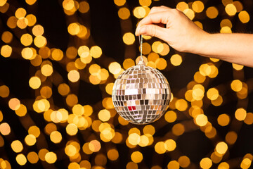 christmas disco ball on new year bokeh background