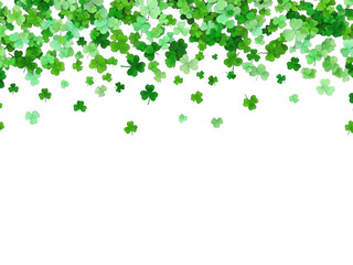 Fototapeta premium Green clover leaves falling from top on transparent background for st patricks day