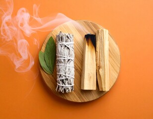 White sage and palo santo sticks are burning in a bundle of incense on a wooden stand against an orange-brown backdrop. Use holy wood sticks for room fumigation and meditation. overview