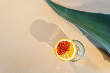 Mezcal shot with orange and chili powder