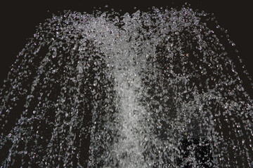 Sprinkling sparkling drops of fountain water