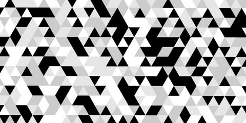 Abstract geometric pattern of triangles in grayscale creating a visual texture, a striking black and white optical illusion features a dynamic pattern of repeating triangles creating a sense of depth. © Abu Bokkor Siddique