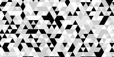 Abstract geometric pattern of triangles in grayscale creating a visual texture, a striking black and white optical illusion features a dynamic pattern of repeating triangles creating a sense of depth. © Abu Bokkor Siddique