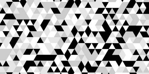 Abstract geometric pattern of triangles in grayscale creating a visual texture, a striking black and white optical illusion features a dynamic pattern of repeating triangles creating a sense of depth. © Abu Bokkor Siddique