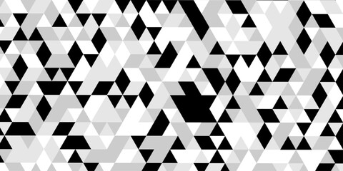 Abstract geometric pattern of triangles in grayscale creating a visual texture, a striking black and white optical illusion features a dynamic pattern of repeating triangles creating a sense of depth. © Abu Bokkor Siddique
