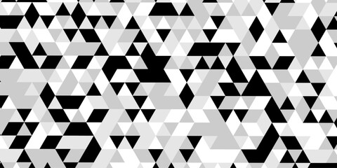 Abstract geometric pattern of triangles in grayscale creating a visual texture, a striking black and white optical illusion features a dynamic pattern of repeating triangles creating a sense of depth. © Abu Bokkor Siddique