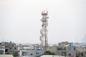 Karachi, Pakistan - December 14, 2025: 4G and 5G wireless communication antenna transmitter. Telecommunication tower with antenna isolated on white background.