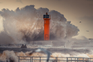 Lighthouse Amidst Violent Ocean Waves