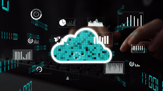 A close-up image showing hands on a keyboard interacting with digital cloud technology and data visualizations, highlighting modern analytics and information management processes. Xenic - Powered by Adobe