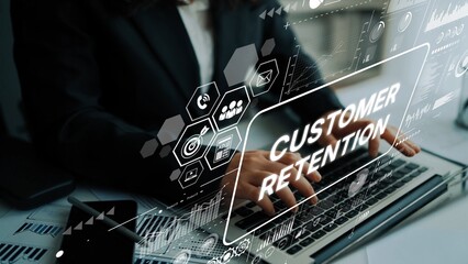 Business professional working on laptop with focus on customer retention concept and digital graphics in a modern office setting. Asymptotic smart data analytic.