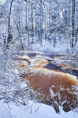 Flooding ice covered river in very cold winter day