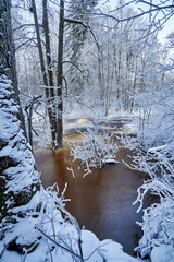 Flooding ice covered river in very cold winter day