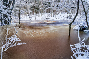 Flooding ice covered river in very cold winter day