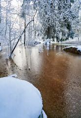 Flooding ice covered river in very cold winter day