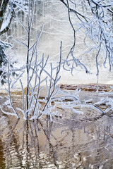 Flooding ice covered river in very cold winter day