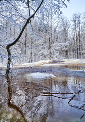 Flooding ice covered river in very cold winter day