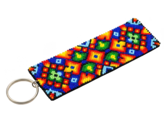 A colorful geometric keychain with a multicolored pattern and a metallic ring attachment isolated on transparent background
