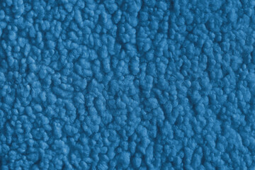 Vibrant blue color fabric texture of soft faux fur cloth with fluffy surface, abstract background. Close up, macro of shaggy fabric texture, upholstery material, textile backdrop © katyamaximenko