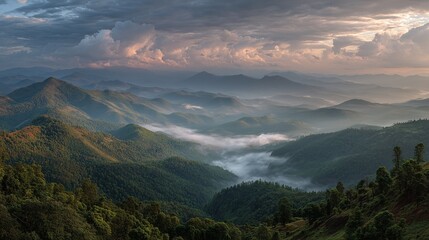 Majestic misty mountain valley at sunrise